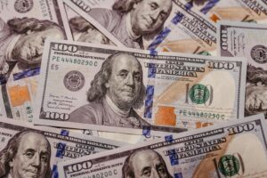 Stack of 100 dollar US banknotes with Benjamin Franklin portrait.